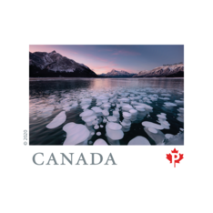  &quot;Far and Wide&quot; collection stamp depicting white methane bubbles in Abraham Lake, Alberta, at dusk. 