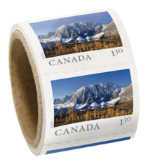 Roll of stamps. Each has British Columbia’s Kootenay National Park forest and mountain range, and &quot;Canada $1.30&quot; text. 